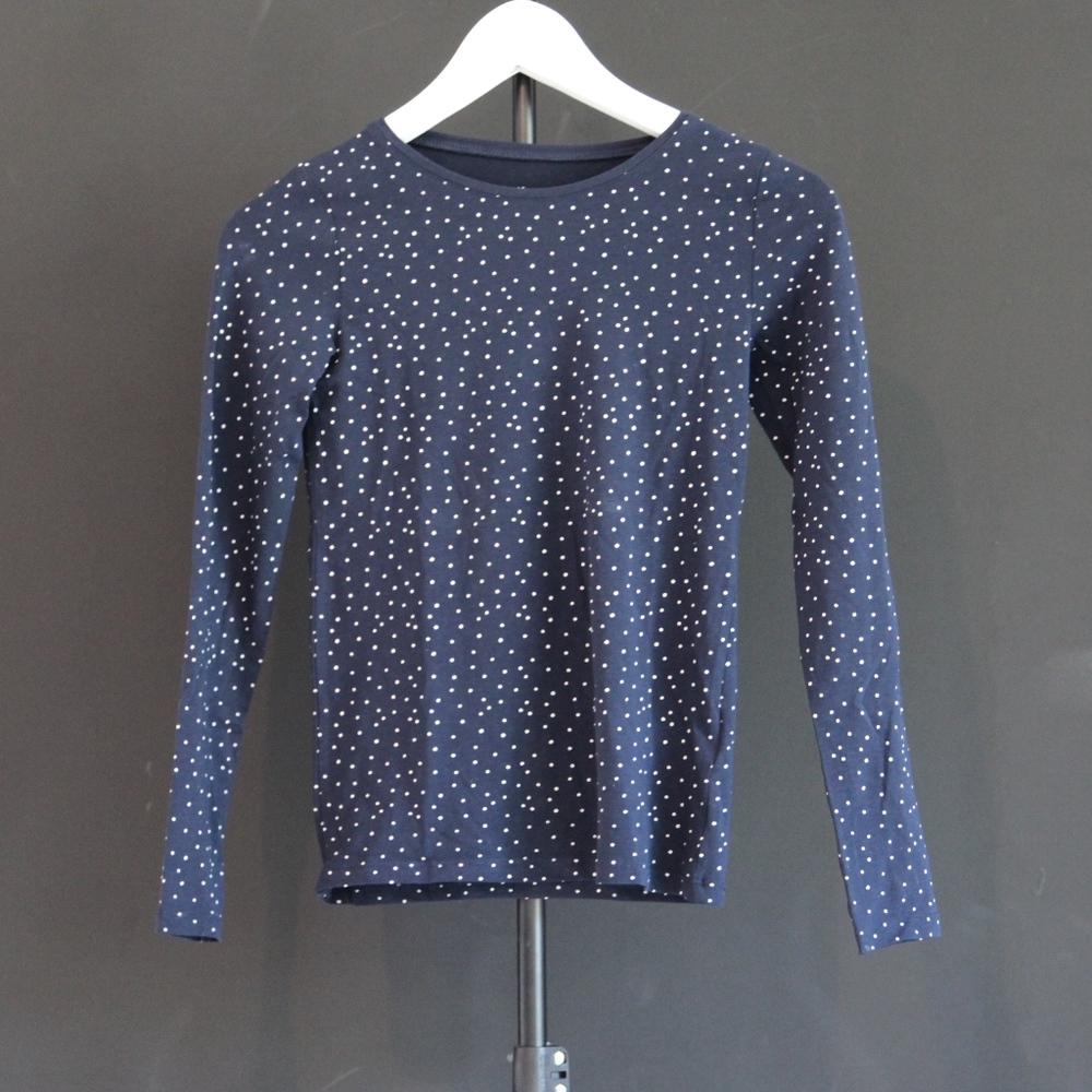 navy and  white polka dotted shirt